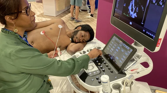 Patient being scanned on Philips Epiq ultrasound cardiac echo ASE 2023.