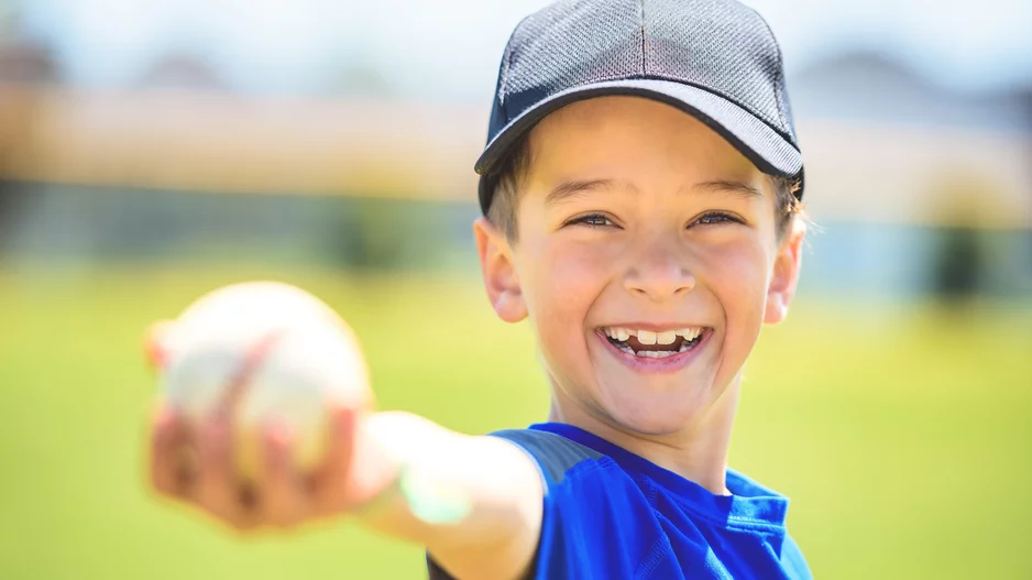 Kid holding baseball